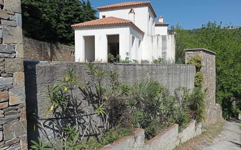 Unfinished villas with pools and views to Skopelos bay