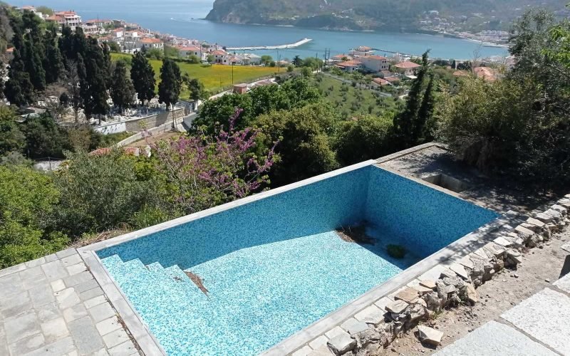 Unfinished villas with pools and views to Skopelos bay