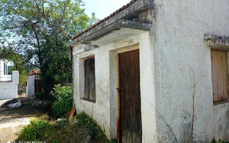 Big land with cottages to renovate close to Panormos beach small cottage