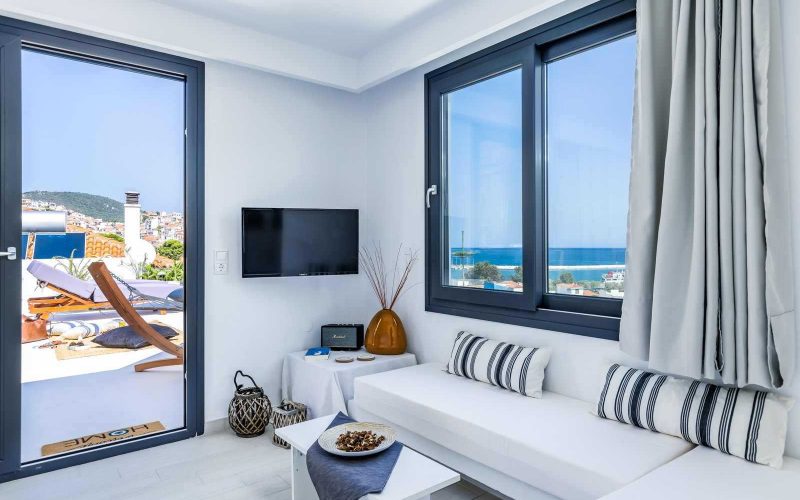 Luxurious Studio with spacious terrace and breathtaking views to Skopelos Town and port Bedroom and Seating room