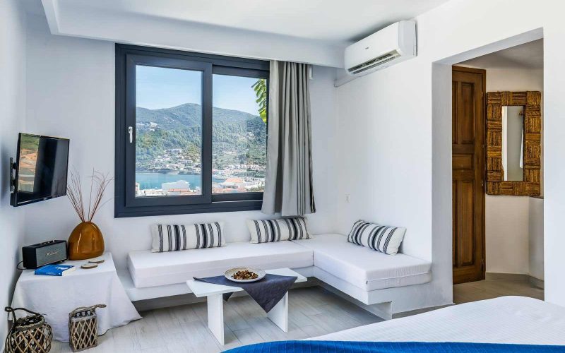 Luxurious Studio with spacious terrace and breathtaking views to Skopelos Town and port Bedroom and Seating room