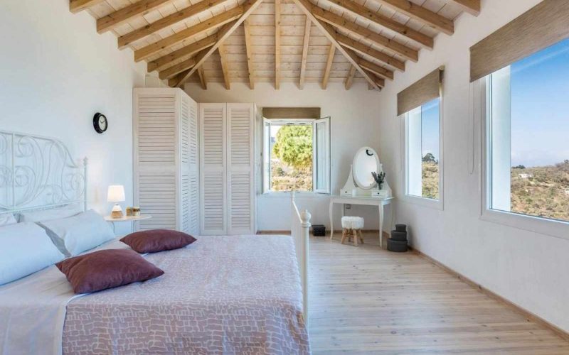 Exquisite pool villa overlooking Skopelos Town and the Aegean Sea The bedroom