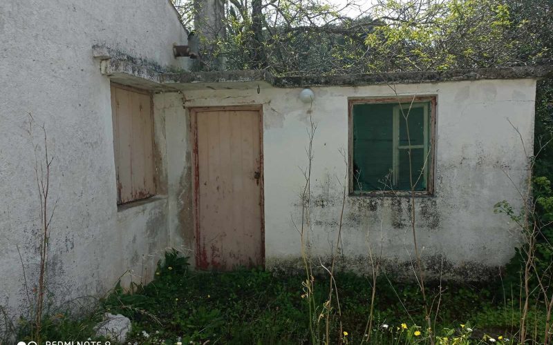 Big land with cottages to renovate close to Panormos beach small cottage